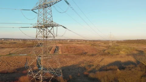 Drone fly close up to a power lines for Inspection. Agricultural field and Stock Footage 127562947