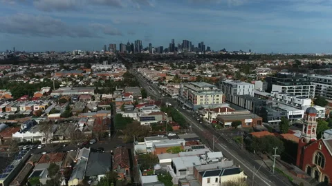 Drone fly down Nicholson St, Brunswick towards Melbourne city Stock Footage 244440795