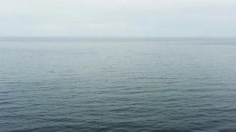 Drone fly forward above the sea, clear horizon. Stock Footage 234020018