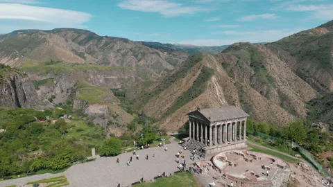 Drone fly forward Garni pagan in mountains. The hellenistic temple in Armenia Stock Footage 195331738