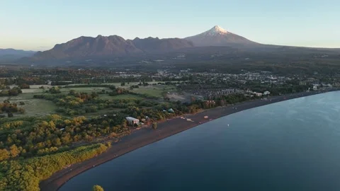 Drone Fly Forward Golden Hour Aerial Lake Villarrica Black Sand Beach Pucon Stock-Footage 336985215