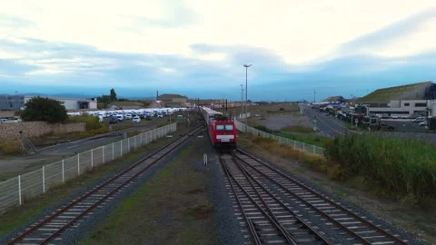 Drone Fly Forward slow motion Over Freight Train Departing Industrial Port Stock Footage 338371632