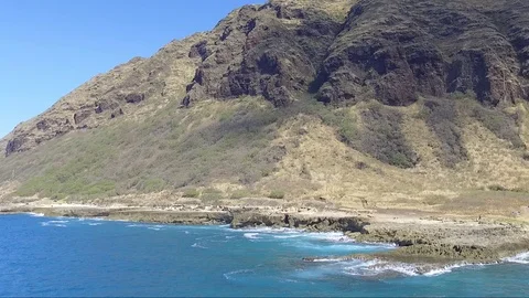 Drone Fly Hawaii Ocean To Mountains Over Rocks Stock Footage