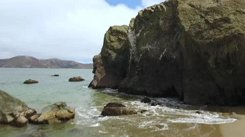 Drone fly Ocean Rocks cliff reveal to Golden Gate Bridge San Francisco Stock-Footage 67163469