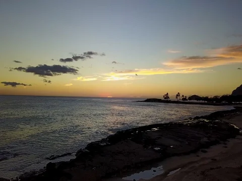 Drone fly out towards sunset on Oahu Stock Footage 80969228