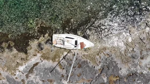 Drone fly-over abandoned boat wreck 動画素材 128994583