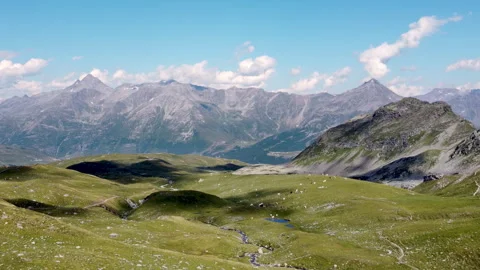 Drone fly over Alpine pastures with Italian Alps in the background Stockbeeldmateriaal 319184630