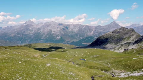 Drone fly over Alpine pastures with Italian Alps in the background Stockbeeldmateriaal 319187006