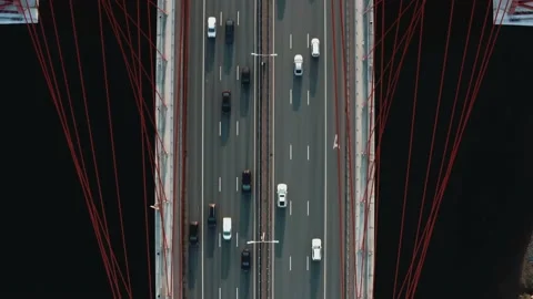 Drone fly over big bridge with river, many cars moving on multi-lane road Stockbeeldmateriaal 144055555