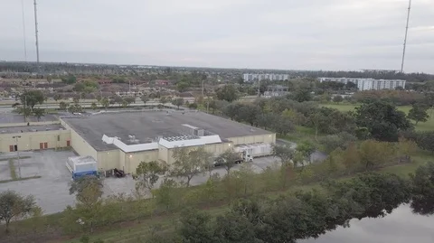 Drone Fly over Building With Pond - Dolly Out Stock Footage 104482683