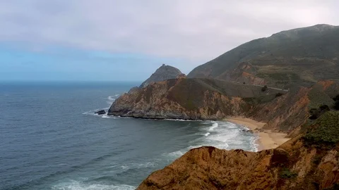 Drone fly over cliff to Gray Whale Cove in McNee Ranch State Park crossed Stock Footage 114603191