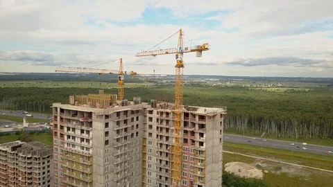 Drone fly over construction new modern building work builders and technicals Stock Footage 104219996
