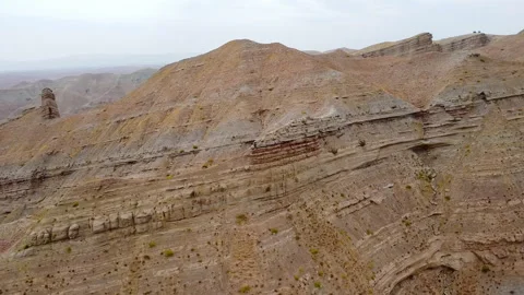 Drone fly over dry ground sun-scorched land of Kyzyl canyon, Boysun Stock Footage 292546071