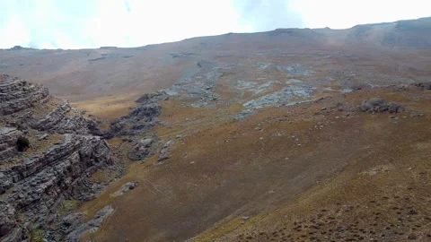 Drone fly over Hojja Gur Gur Ota, Father of all caves. Rocky mountain covered Stock Footage 292542956