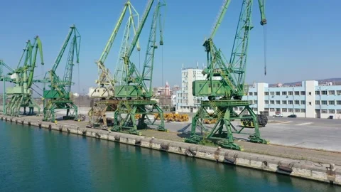 Drone fly over inactive, not working, closed port, cranes standing on a pier Stock Footage 176698483