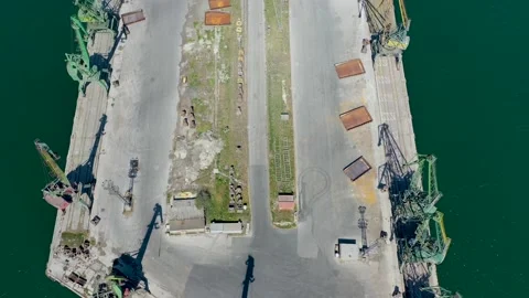 Drone fly over inactive, not working, closed port, cranes standing on a pier Stock Footage 197511342