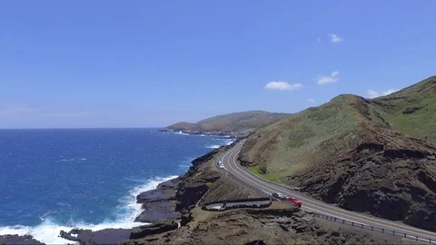 Drone Fly Over Ocean Rocky Cliffs And Highway Flying Left Curve 動画素材 78554917