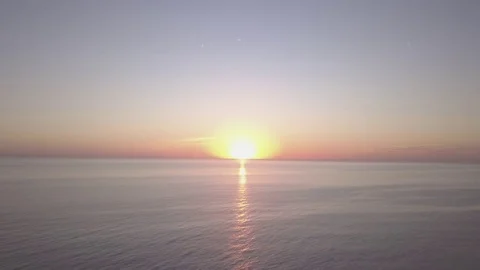 Drone fly over ocean towards sunset Stock Footage 82760733