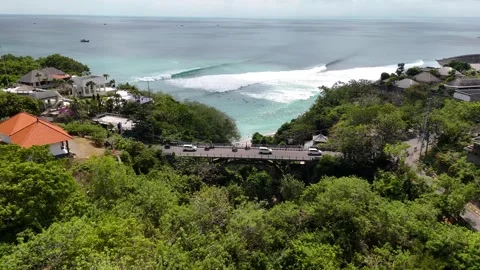 Drone Fly Over Padang Padang bridge with Waves Breaking Video stock 330472964