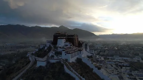 Drone Fly-Over of Potala Palace at Sunrise Revealing Lhasa, Tibet China Stock Footage 336939161