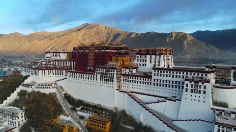 Drone Fly-Over of Potala Palace at Sunrise Revealing Lhasa, Tibet China Stock Footage 336939497