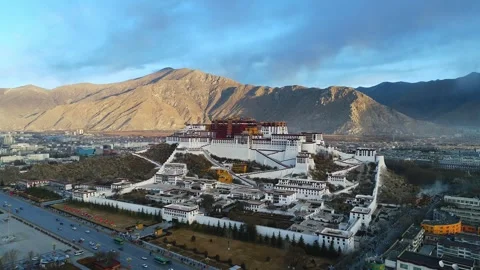 Drone Fly-Over of Potala Palace at Sunrise Revealing Lhasa, Tibet China Stock Footage 337167989