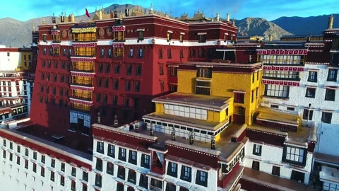 Drone Fly-Over of Potala Palace at Sunrise Revealing Lhasa, Tibet China Stock Footage 337168022