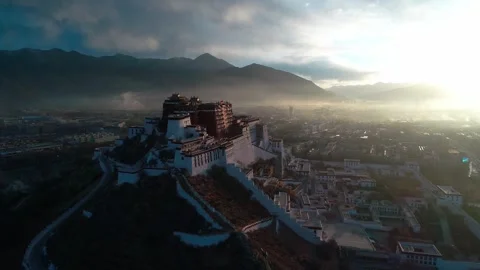 Drone Fly-Over of Potala Palace at Sunrise Revealing Lhasa, Tibet China Stock Footage 337168126