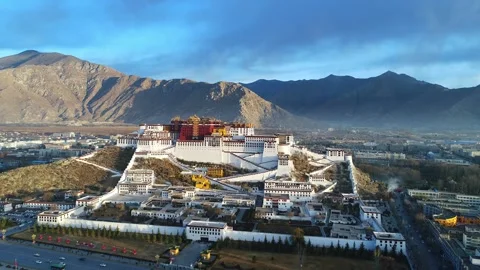 Drone Fly-Over of Potala Palace at Sunrise Revealing Lhasa, Tibet China Stock Footage 337168143