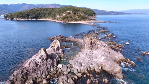 Drone Fly Over Rocks Towards Manazuru Cape Forest│Japan Stock Footage 329057795