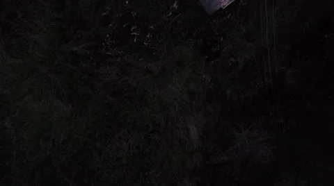 Drone fly-over of run-down old buildin in sun set. High angle.  Stockbeeldmateriaal 44869308