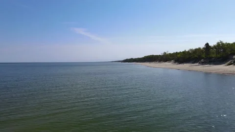 Drone fly over the sea with sandy beach and forest on Baltic sea. 4k drone video Stock Footage 154716463