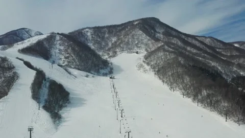 Drone fly over a ski resort in Hakuba Japan Stock Footage 165647844