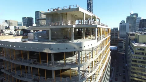 Drone fly over skyscapper rooftop revealing a city at the horizon Stock Footage 64141105