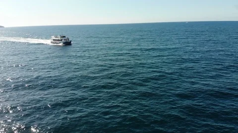 Drone fly-over towards boat 動画素材 128996260