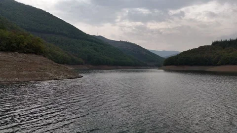 Drone fly over the water inside a valley Video stock 295434242