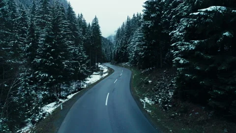 Drone fly over winter snowy asphalt road in forest 스톡 동영상 269501998
