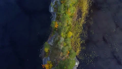 Drone fly slow above small island in the lake 動画素材 230268792