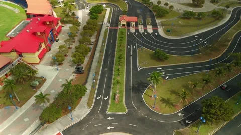 Drone Fly Through Toward Red And Beige Clock Tower In Lauderhill Video stock 339063853