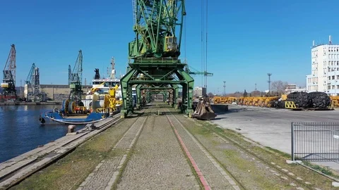 Drone fly under cranes standing on a pier.Steel industrial, port structure 4k Stock Footage 126324975