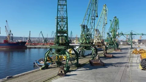 Drone fly under cranes standing on a pier.Steel industrial, port structure 4k Stock Footage 126652714