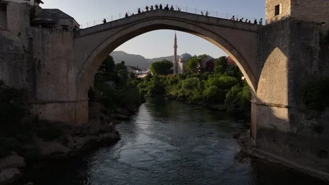 Drone Fly Under Stari Most Bridge Framing Koski Mehmed Pasha Mosque 4K Vídeos de archivo 337831084