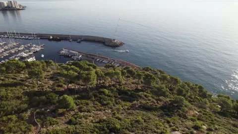 Drone fly-by view over the a small nautical port in the Mediterranean Sea Stock Footage 168729050