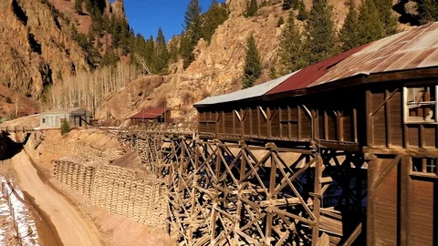 Drone flyby of abandoned Commodore Mine in canyon above Creede, CO. Stock Footage 103544833