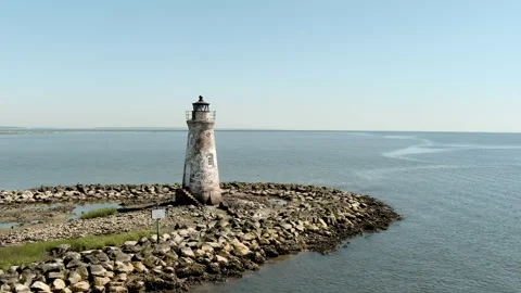 Drone flyby of abandoned lighthouse on Tybee Island Stock Footage 192485247