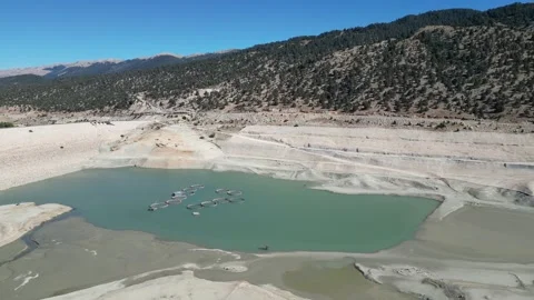Drone flyby above dried-up pond Stock Footage 300003905