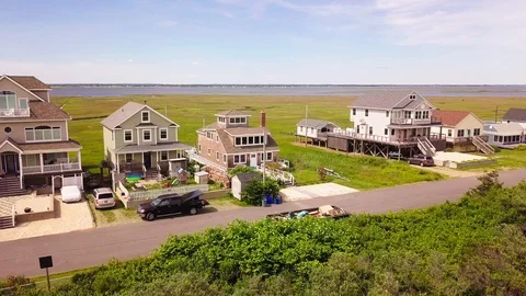 Drone flyby Beutiful Gilgo Beach houses Long Island Stock Footage 112582113