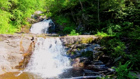 Drone Flyby of Cascading Waterfall in Forest Landscape Stock Footage 292816376