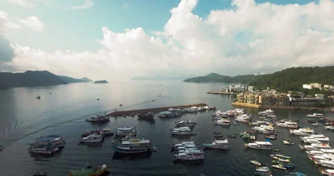Drone flyby shot of boats parked at the Hong Kong Sai Kung pier Stock Footage 142302853