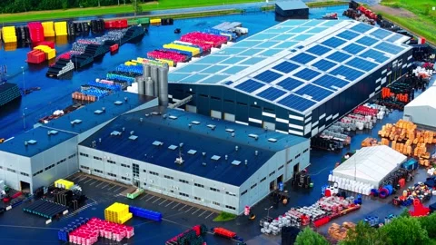 Drone Flyby of Sustainable Plastic Pipe Manufacturing Plant with Solar Roof Stock Footage 340597327